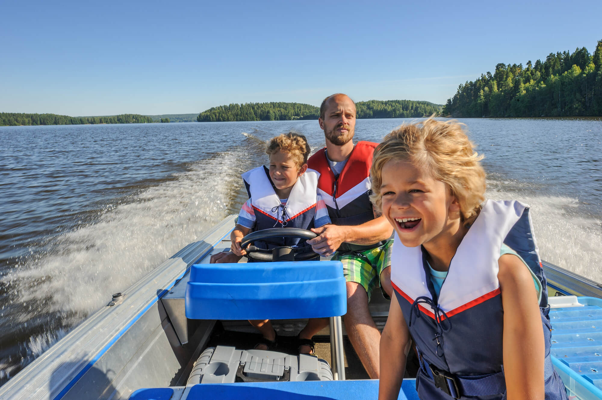 a man with his kids considering Boat Lift installation in Boca Raton